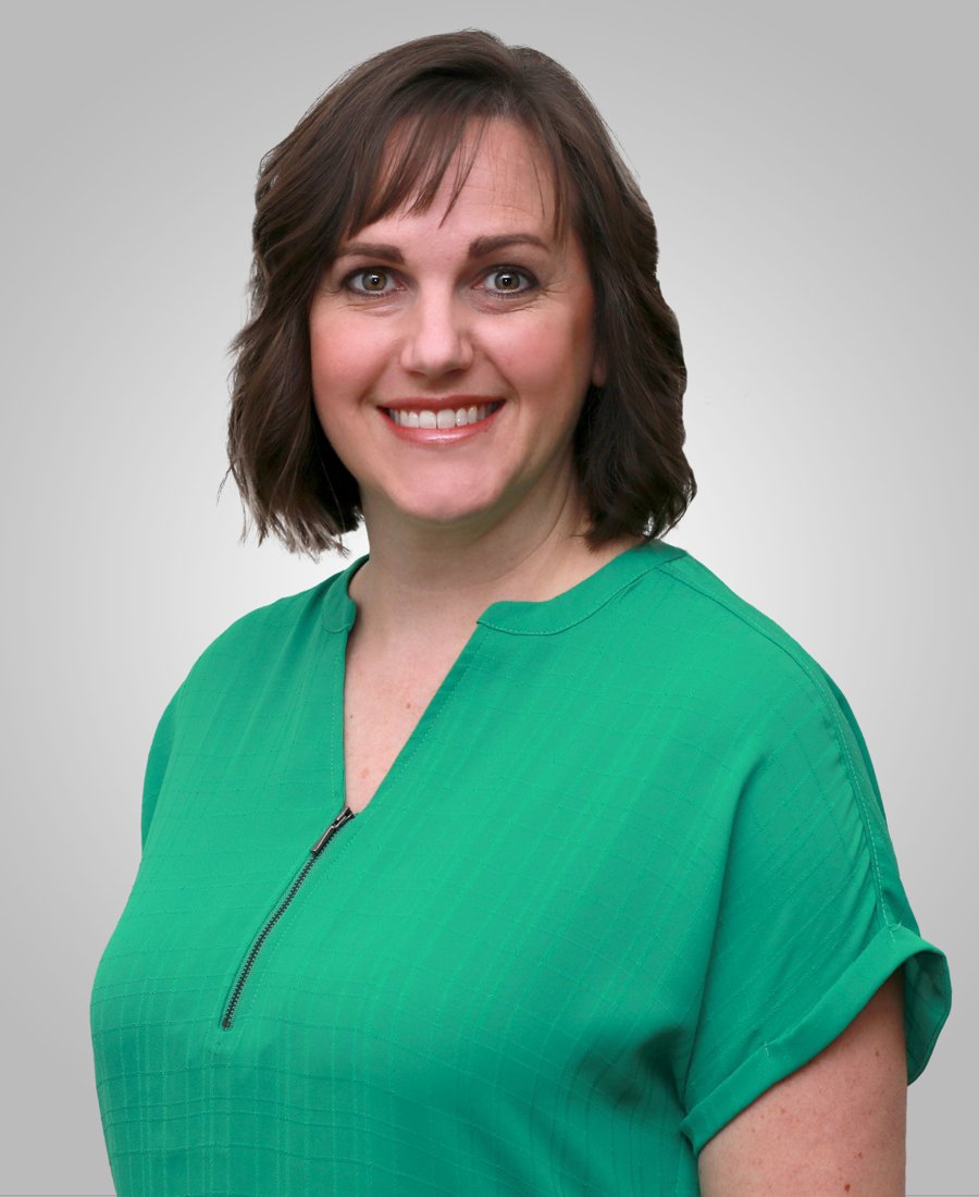 Laura Wilson, smiling, in a green blouse